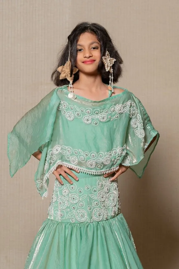 Elegant mint Green top and Lahenga with intricate white embroidery and a flowing silhouette, perfect for making a stylish statement at any festive occasion.